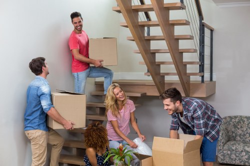 Person moving storage items safely in a Forestdale Storage facility