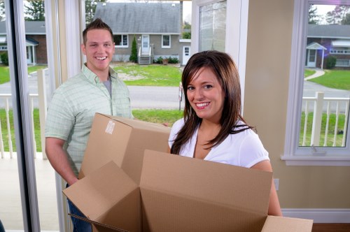 Professional movers handling residential items in Forestdale