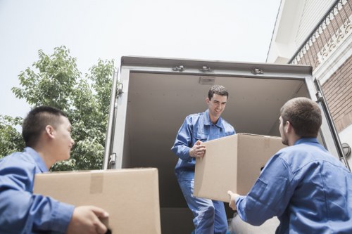 Moving team handling apartment furniture in Forestdale