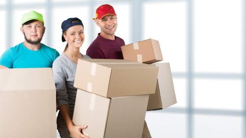 Small removals service loading furniture and boxes for local delivery