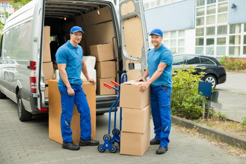 A removals truck loading household furniture for a local move