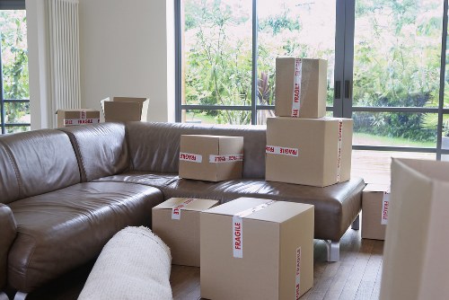 Packing boxes and labeling items for removals in Forestdale