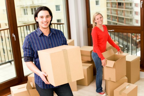 Careful wrapping and boxing of household items for moving day